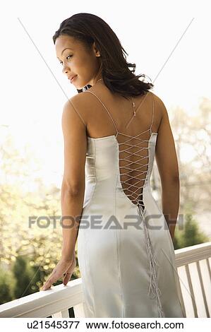 Stock Photo - Woman in elegant evening gown. Fotosearch