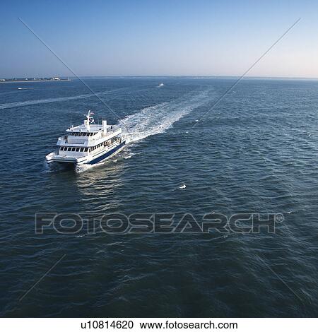 Aerial view of passenger ferry boat in open waters near Bald Head Island, North Carolina. View Large Photo Image Stock Image - Aerial view of passenger ferry boat in open waters near Bald Head Island, North Carolina.. Fotosearch