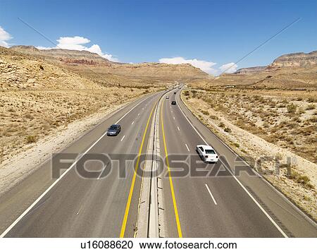 Birds eye view of automobiles on rural desert highway View Large Photo Image Stock Image - Birds eye view of automobiles on rural desert highway. Fotosearch