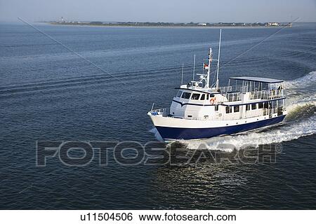 Ferry boat across Atlantic Ocean near Bald Head Island, North Carolina View Large Photo Image Stock Photograph - Ferry boat across Atlantic Ocean near Bald Head Island, North Carolina. Fotosearch