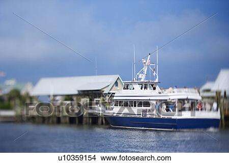 Ferry boat heading into port on Bald Head Island, North Carolina. View Large Photo Image Picture - Ferry boat heading into port on Bald Head Island, North Carolina.. Fotosearch