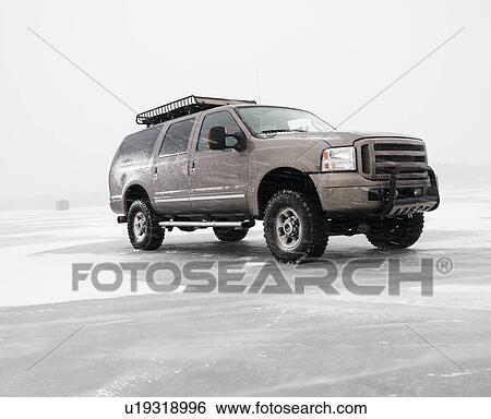 Four wheel drive truck with roof rack parked on desolate frozen lake View Large Photo Image Stock Photograph - Four wheel drive truck with roof rack parked on desolate frozen lake. Fotosearch