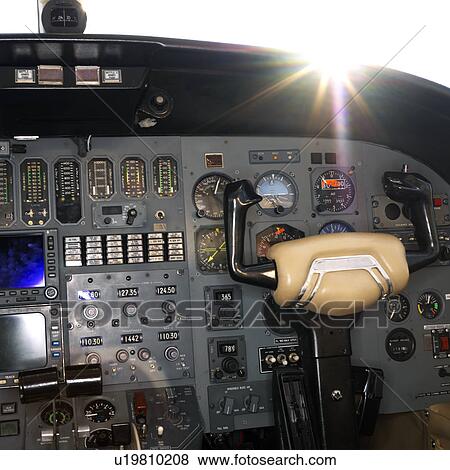 Interior shot of a airplane with the sun peeking over dashboard. View Large Photo Image Stock Photo - Interior shot of a airplane with the sun peeking over dashboard.. Fotosearch
