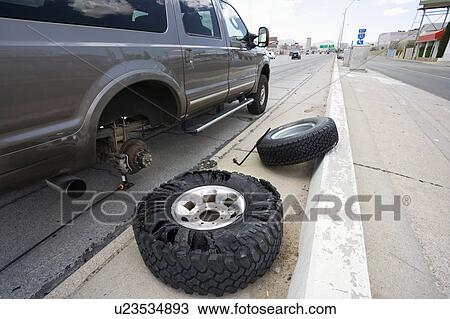 Vehicle broken down with damaged tires View Large Photo Image Stock Image - Vehicle broken down with damaged tires . Fotosearch