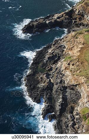 Aerial of coast with rocky cliff in Maui, Hawaii. View Large Photo Image Stock Image - Aerial of coast with rocky cliff in Maui, Hawaii.. Fotosearch