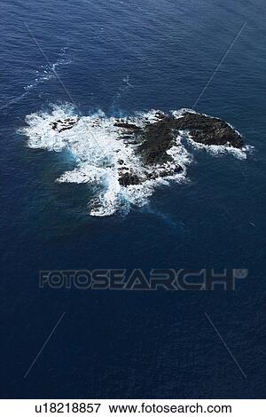 Aerial of rock in Pacific ocean off coast of Maui, Hawaii View Large Photo Image Stock Photo - Aerial of rock in Pacific ocean off coast of Maui, Hawaii. Fotosearch