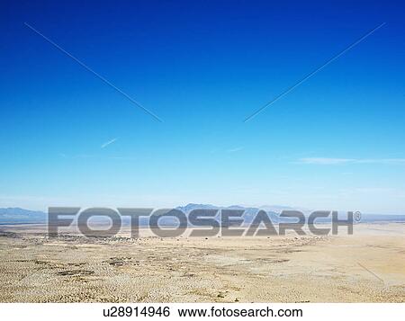 Aerial view of remote California desert with mountain range in background. View Large Photo Image Stock Photograph - Aerial view of remote California desert with mountain range in background.. Fotosearch