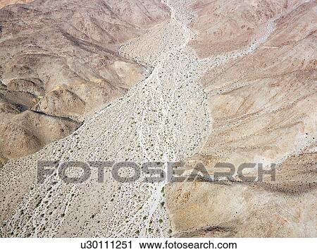 Aerial view of torrid California desert with rocky landforms. View Large Photo Image Stock Image - Aerial view of torrid California desert with rocky landforms.. Fotosearch
