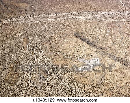 Aerial view of torrid California desert with rocky landforms. View Large Photo Image Stock Photo - Aerial view of torrid California desert with rocky landforms.. Fotosearch