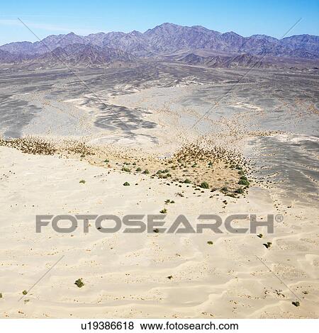 California desert with mountain range in background View Large Photo Image Stock Photo - California desert with mountain range in background. Fotosearch