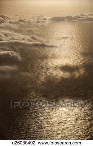Looking down through clouds into Pacific ocean View Large Photo Image Stock Image - Looking down through clouds into Pacific ocean. Fotosearch