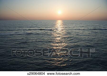 Scenic aerial seascape of ocean during sunset at Baldhead Island, North Carolina. View Large Photo Image Picture - Scenic aerial seascape of ocean during sunset at Baldhead Island, North Carolina.. Fotosearch