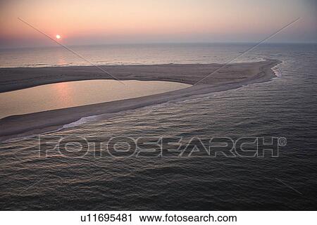 Scenic aerial view of sandbar at Baldhead Island, North Carolina at dusk View Large Photo Image Stock Image - Scenic aerial view of sandbar at Baldhead Island, North Carolina at dusk. Fotosearch