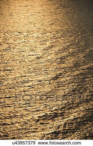 Sun reflecting golden on Atlantic ocean. View Large Photo Image Stock Photo - Sun reflecting golden on Atlantic ocean.. Fotosearch