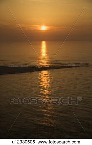 Sunset over ocean with breakwater View Large Photo Image Stock Photography - Sunset over ocean with breakwater. Fotosearch