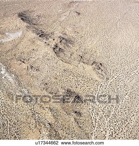 Torrid California desert with rocky landforms View Large Photo Image Stock Image - Torrid California desert with rocky landforms. Fotosearch