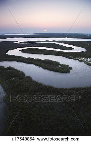 Picture - Winding waterway in marshland at Baldhead Island, North Carolina. Fotosearch