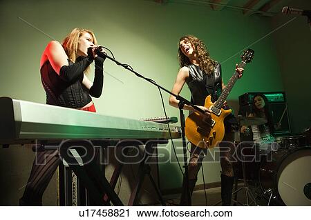 Caucasian girl band playing instruments. View Large Photo Image Stock Image - Caucasian girl band playing instruments.. Fotosearch