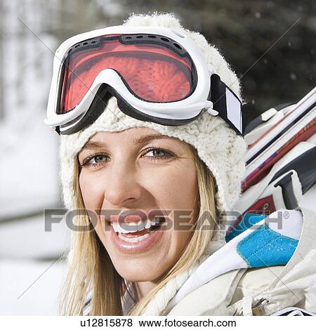 Stock Photo - Attractive young blond woman in winter ski gear smiling.. Fotosearch