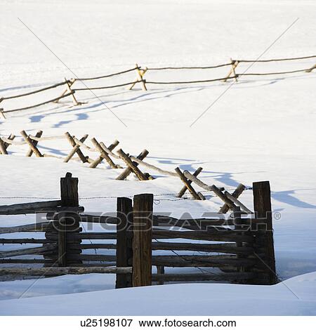 Fence in snow covered landscape View Large Photo Image Stock Photo - Fence in snow covered landscape. Fotosearch