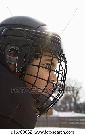 Hockey player boy in helmet View Large Photo Image Stock Image - Hockey player boy in helmet. Fotosearch