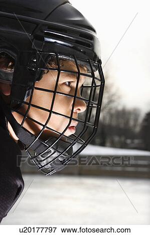Stock Photo - Hockey player in uniform. Fotosearch