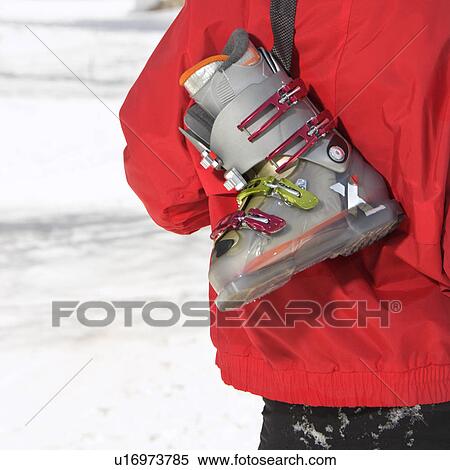 Ski boot over the shoulder View Large Photo Image Stock Photography - Ski boot over the shoulder. Fotosearch