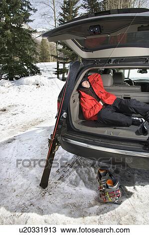 Sleeping in back of SUV with ski gear View Large Photo Image Stock Image - Sleeping in back of SUV with ski gear. Fotosearch