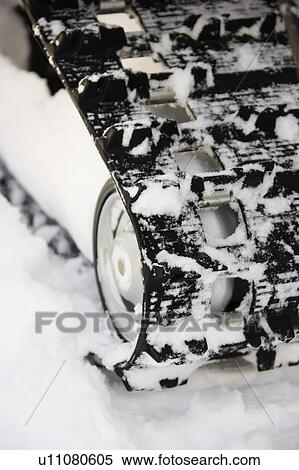 Snowmobile rubber track in snow View Large Photo Image Stock Photography - Snowmobile rubber track in snow. Fotosearch