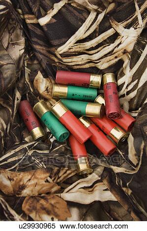 Still life shot of shotgun shells against camouflage clothing. View Large Photo Image Stock Photography - Still life shot of shotgun shells against camouflage clothing.. Fotosearch
