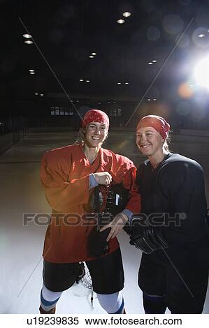 Women hockey players in uniform posing with helmets off on ice rink View Large Photo Image Stock Photography - Women hockey players in uniform posing with helmets off on ice rink. Fotosearch