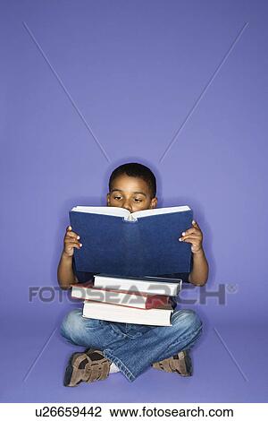 African American male child sitting with books. View Large Photo Image Stock Image - African American male child sitting with books.. Fotosearch
