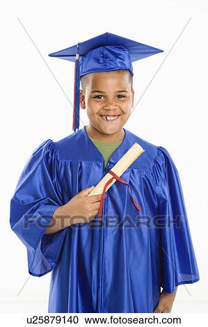 Boy wearing blue graduation gown holding diploma View Large Photo Image Stock Image - Boy wearing blue graduation gown holding diploma. Fotosearch