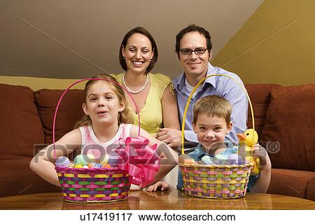 Caucasian family with Easter baskets looking at viewer. View Large Photo Image Stock Photo - Caucasian family with Easter baskets looking at viewer. . Fotosearch