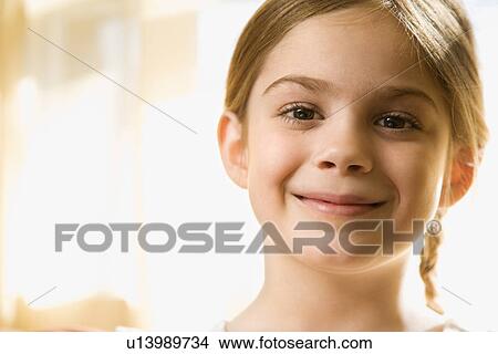 Caucasian girl smiling at viewer. View Large Photo Image Picture - Caucasian girl smiling at viewer.. Fotosearch