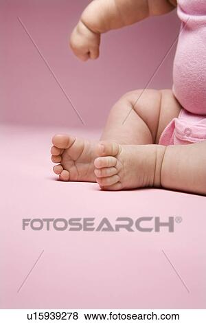 Close up of Asian babys legs and feet and arm. View Large Photo Image Stock Photo - Close up of Asian babys legs and feet and arm.. Fotosearch