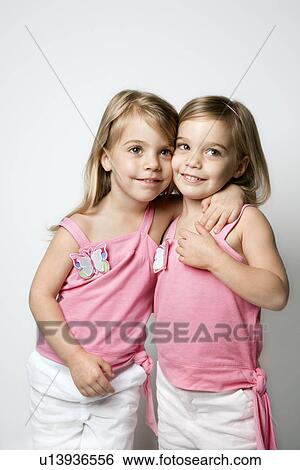 Stock Photograph - Female children Caucasian twins.. Fotosearch