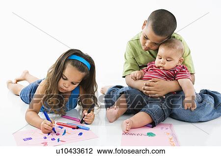 Girl coloring on construction paper while brothers watch View Large Photo Image Stock Image - Girl coloring on construction paper while brothers watch. Fotosearch