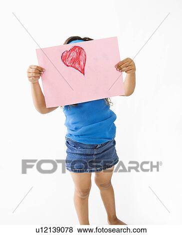 Stock Photo - Girl showing off drawing of heart. Fotosearch