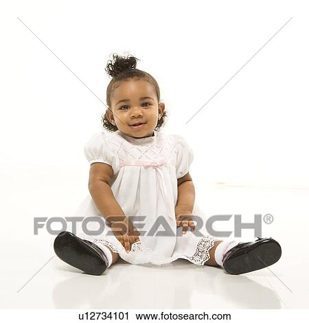 Portrait of African American infant girl sitting against white background. View Large Photo Image Stock Image - Portrait of African American infant girl sitting against white background.. Fotosearch