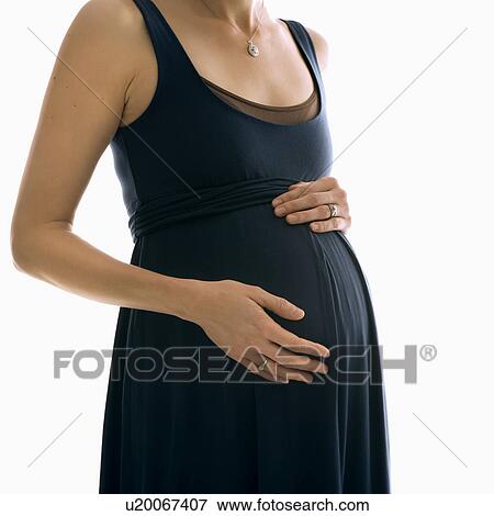 Portrait of Caucasion mid-adult pregnant woman with hands on belly. View Large Photo Image Stock Photo - Portrait of Caucasion mid-adult pregnant woman with hands on belly.. Fotosearch