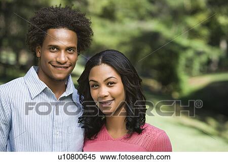 Stock Photography - Attractive couple in park. Fotosearch
