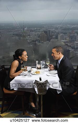 Stock Photo - Couple having dinner at the Tower of the Americas in San Antonio Texas. Fotosearch