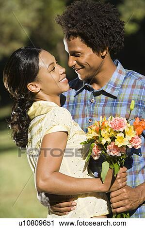 Woman and man embracing View Large Photo Image Stock Image - Woman and man embracing. Fotosearch