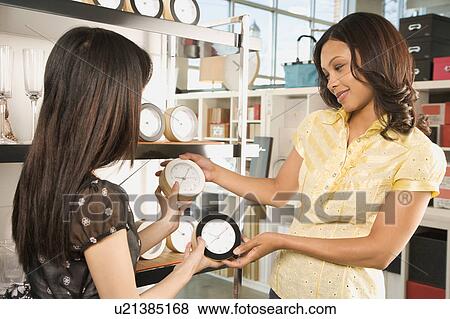 Shopping for clocks View Large Photo Image Stock Photo - Shopping for clocks . Fotosearch