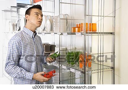 Stock Image - Shopping for dishes and glasses . Fotosearch