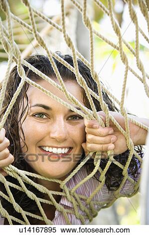 Looking through the rope on a hammock View Large Photo Image Stock Photography - Looking through the rope on a hammock. Fotosearch