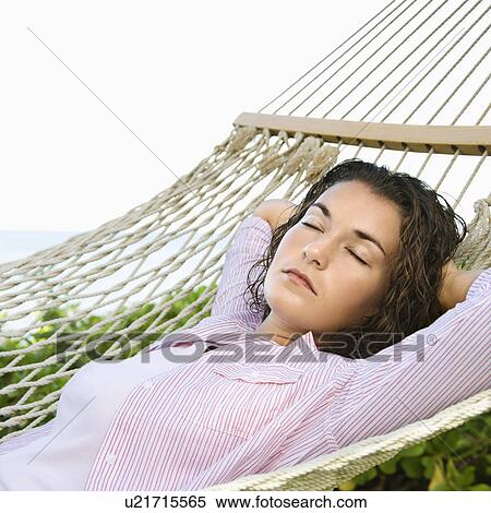Lying in hammock with arms behind head sleeping View Large Photo Image Stock Photography - Lying in hammock with arms behind head sleeping. Fotosearch