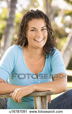 Stock Image - Portrait of a woman outdoors. Fotosearch