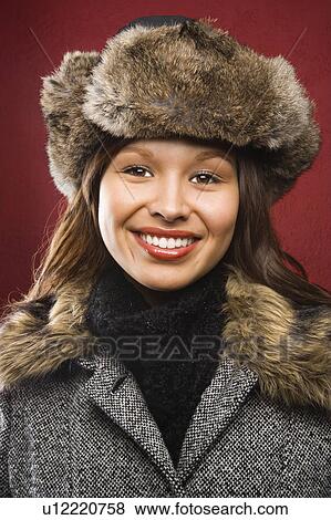Stock Photo - Portrait of woman in coat and hat. Fotosearch